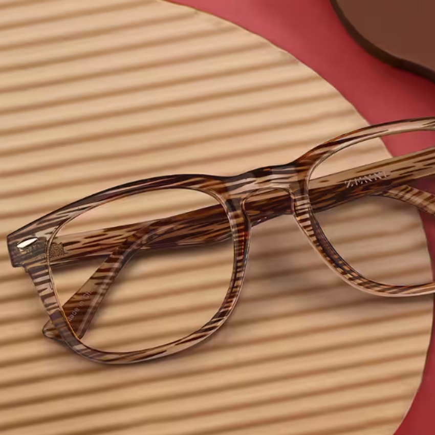 Brown-hued eyeglasses with a wood-grain pattern, rectangular frames, and clear lenses.